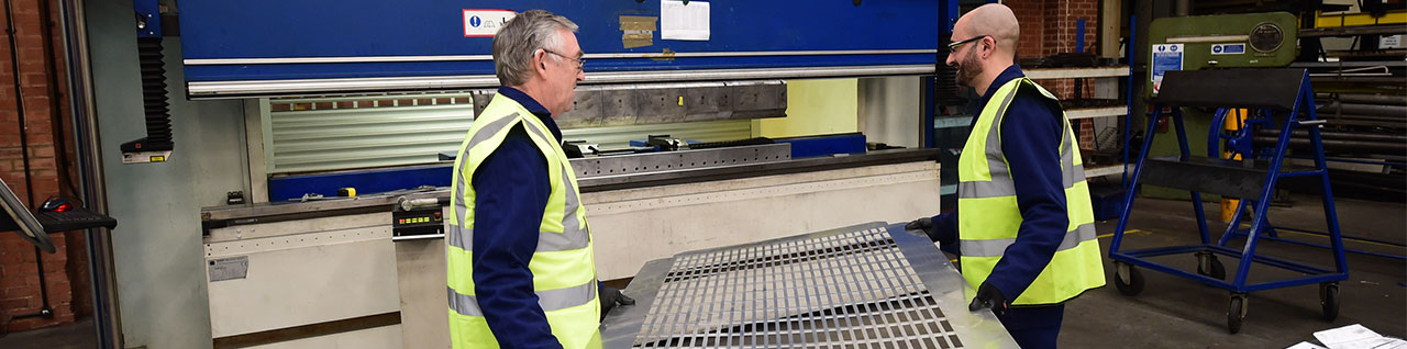 HTA staff lifting metal